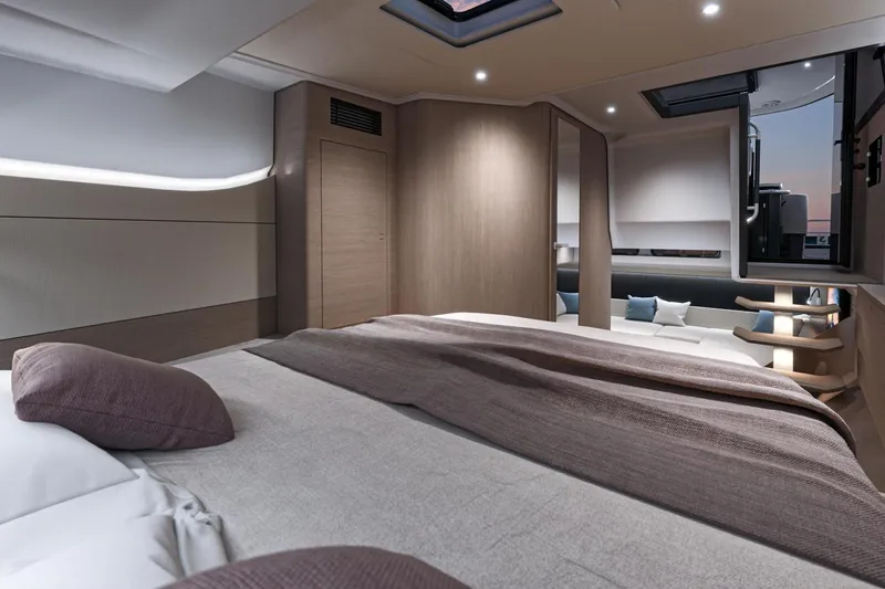 Slide: The Image of Luxurious interior of 2026 Beneteau Gran Turismo 40 yacht cabin with modern design. - 16