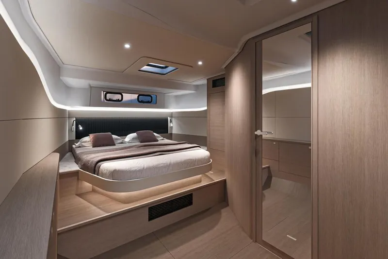Slide: The Image of Luxurious cabin interior of 2026 Beneteau Gran Turismo 40 yacht, featuring modern design and cozy bedding. - 17