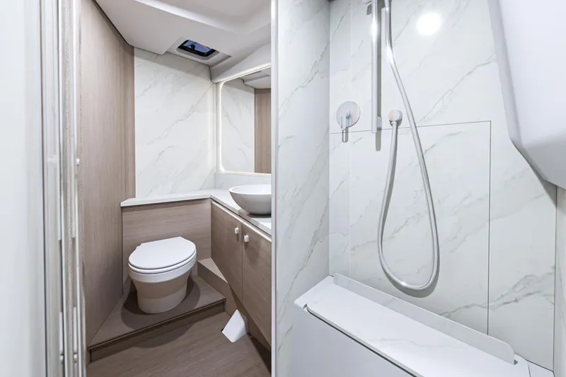 Slide: The Image of Luxurious bathroom in 2026 Beneteau Gran Turismo 40 yacht, featuring modern fixtures and elegant design. - 18