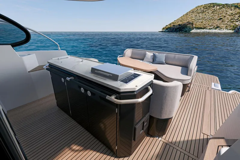 Slide: The Image of 2026 Beneteau Gran Turismo 40 yacht deck with seating and ocean view. - 19