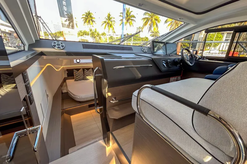 Slide: The Image of 2026 Beneteau Gran Turismo 40 yacht interior with modern helm and cozy cabin. - 2
