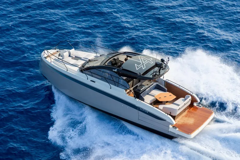 Slide: The Image of 2026 Beneteau Gran Turismo 40 yacht cruising on open blue sea. - 23