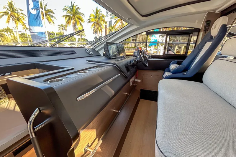 Slide: The Image of Interior of 2026 Beneteau Gran Turismo 40 yacht with modern dashboard and seating. - 3