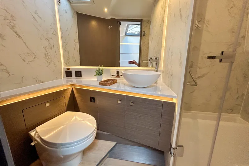Slide: The Image of Luxurious bathroom in 2026 Beneteau Gran Turismo 40 yacht with modern fixtures and elegant design. - 6