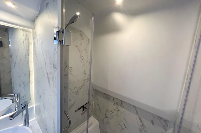Slide: The Image of Luxurious bathroom in 2026 Beneteau Gran Turismo 40 yacht with marble accents. - 7
