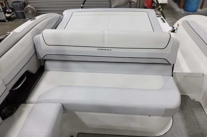 Slide: The Image of 2026 Formula 240 Bowrider boat interior with sleek white seating and modern design. - 11