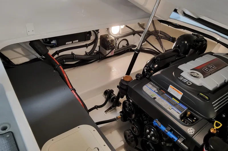 Slide: The Image of Engine compartment of 2026 Formula 240 Bowrider, featuring a 6.2L 350 horsepower engine. - 13