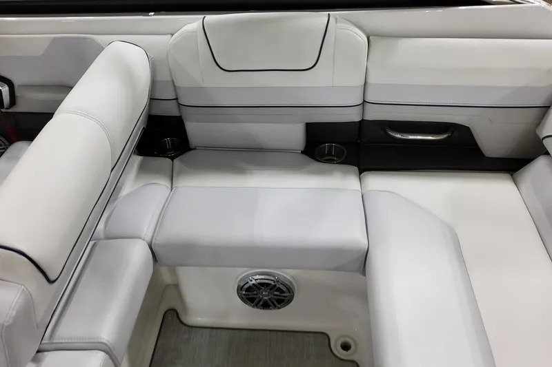 Slide: The Image of 2026 Formula 240 Bowrider interior seating with white upholstery and cup holders. - 16