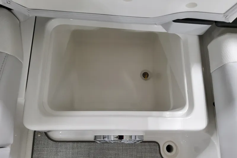 Slide: The Image of 2026 Formula 240 Bowrider interior storage compartment with drain plug. - 17
