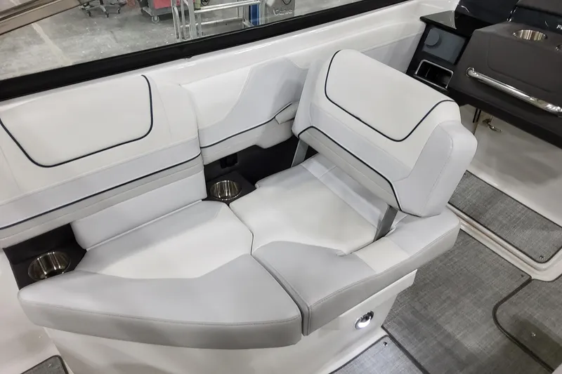 Slide: The Image of 2026 Formula 240 Bowrider interior seating with modern design and cup holders. - 21