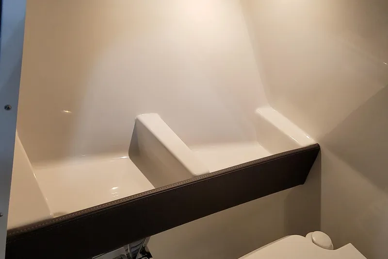 Slide: The Image of 2026 Formula 240 Bowrider interior cabin with seating and storage area. - 25