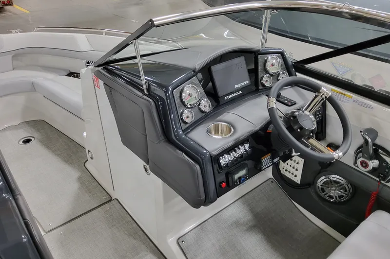 Slide: The Image of 2026 Formula 240 Bowrider cockpit with modern steering, gauges, and seating. - 27