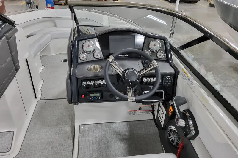 Slide: The Image of 2026 Formula 240 Bowrider dashboard with steering wheel and control panel. - 28