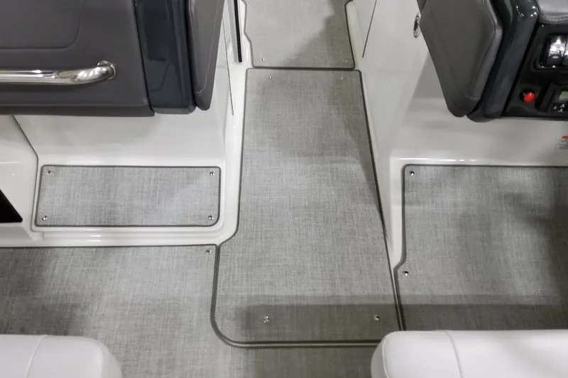 Slide: The Image of 2026 Formula 240 Bowrider interior flooring with sleek, modern design and gray carpeting. - 29