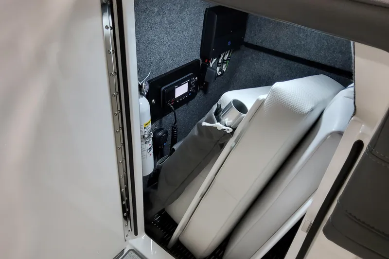 Slide: The Image of Interior of 2026 Formula 240 Bowrider boat with safety equipment and storage. - 32