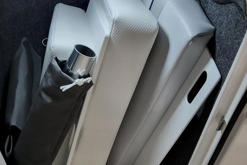 Slide: The Image of 2026 Formula 240 Bowrider interior storage with cushions and accessories. - 33