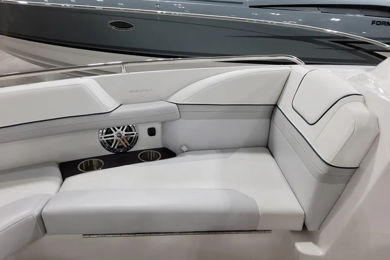 Slide: The Image of 2026 Formula 240 Bowrider interior with white seating and built-in cup holders. - 35