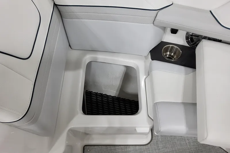 Slide: The Image of 2026 Formula 240 Bowrider interior seating with storage compartment and cup holder. - 38