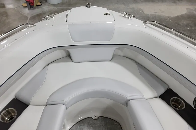 Slide: The Image of 2026 Formula 240 Bowrider interior with white cushioned seating and stainless steel cup holders. - 39