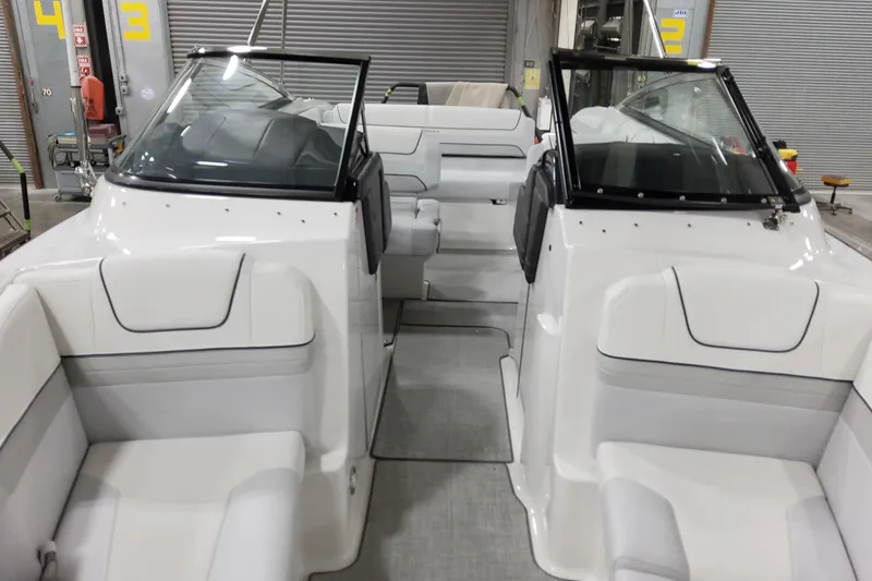 Slide: The Image of 2026 Formula 240 Bowrider interior with sleek white seating and modern design. - 43