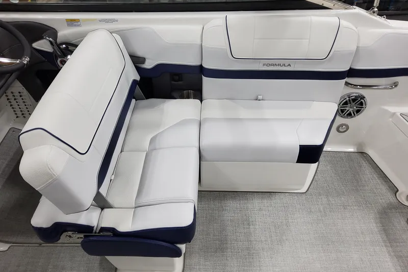 Slide: The Image of 2026 Formula 270 Bowrider interior with white and navy seating, modern design. - 13