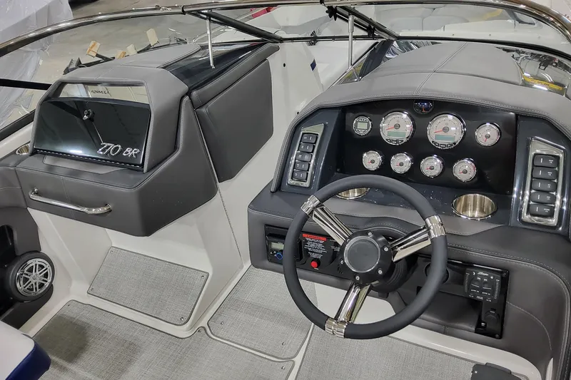 Slide: The Image of 2026 Formula 270 Bowrider dashboard with steering wheel, gauges, and controls. - 14