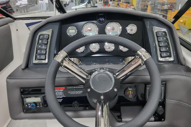 Slide: The Image of Steering wheel and dashboard of 2026 Formula 270 Bowrider boat with gauges and controls. - 15
