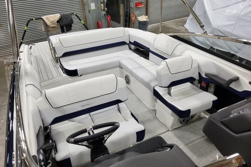 Slide: The Image of 2026 Formula 270 Bowrider interior with white and navy seating, sleek design. - 21