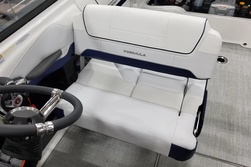 Slide: The Image of 2026 Formula 270 Bowrider interior with white seating and steering wheel. - 26