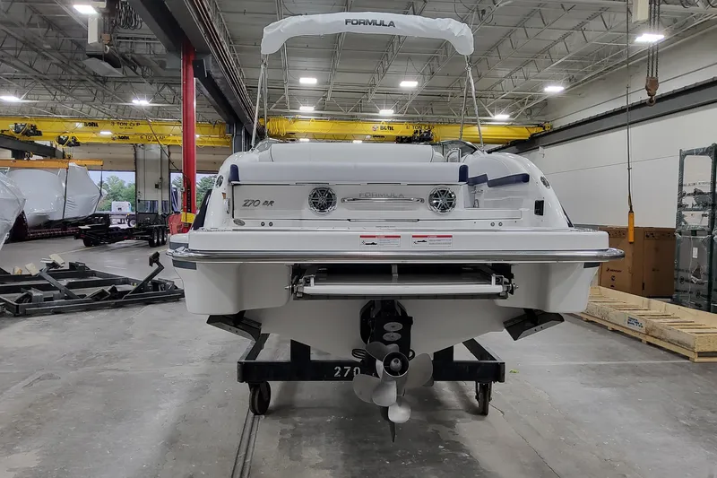 Slide: The Image of 2026 Formula 270 Bowrider boat in a warehouse, rear view. - 3