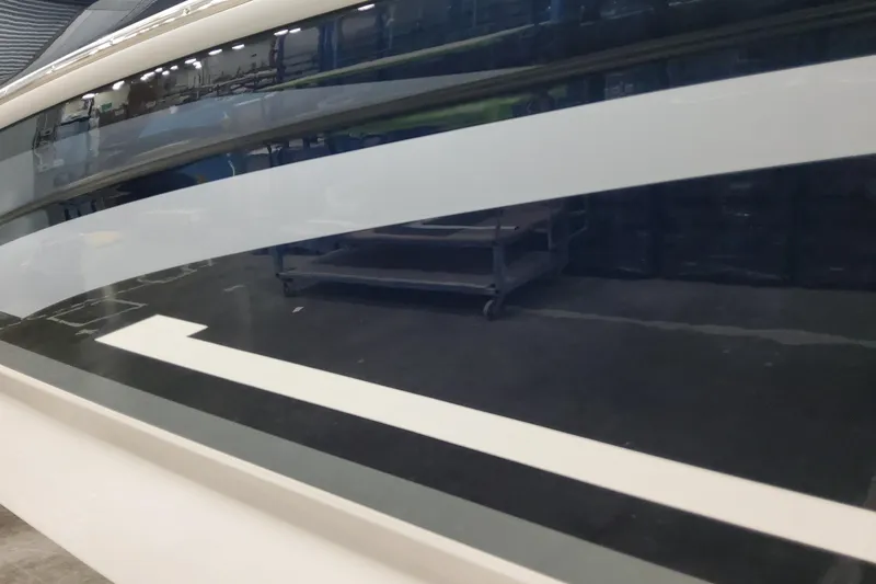 Slide: The Image of 2026 Formula 270 Bowrider boat with sleek, modern design in a showroom setting. - 5