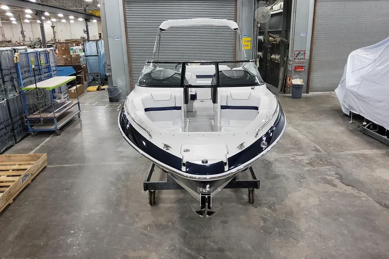 Slide: The Image of 2026 Formula 270 Bowrider boat in a warehouse, front view. - 6