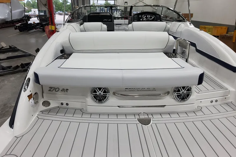 Slide: The Image of 2026 Formula 270 Bowrider boat interior with white seating and sleek design. - 8