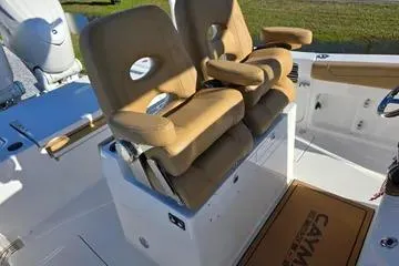 Slide: The Image of 2026 Caymas 291 boat interior with tan seating and modern design. - 6