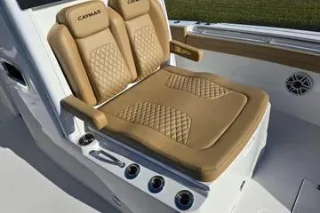 Slide: The Image of 2026 Caymas 291 boat with tan leather seating and diamond stitching. - 9