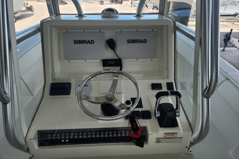Slide: The Image of 2012 SeaVee 340B boat helm with Simrad electronics and steering wheel. - 6
