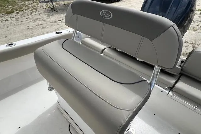 Slide: The Image of 2023 Key West 189 FS boat seat with gray upholstery and KW logo. - 3