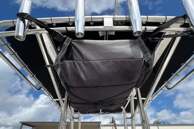 Slide: The Image of 2023 Key West 189 FS boat with T-top storage bag under blue sky. - 5