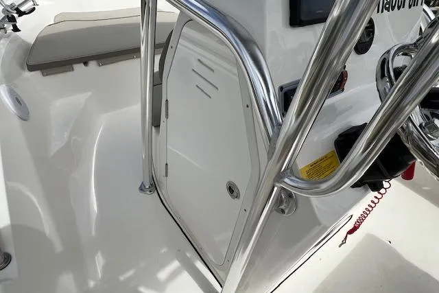 Slide: The Image of 2023 Key West 189 FS boat interior with steering console and stainless steel railings. - 6