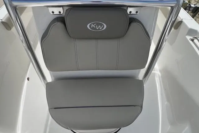 Slide: The Image of 2023 Key West 189 FS boat seat with gray upholstery and KW logo. - 7