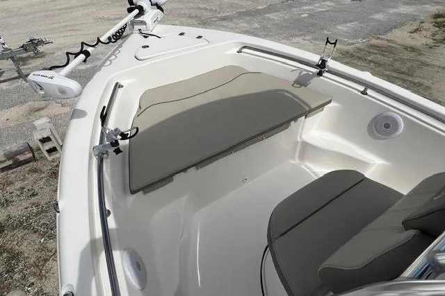 Slide: The Image of 2023 Key West 189 FS boat interior with cushioned seating and trolling motor. - 8