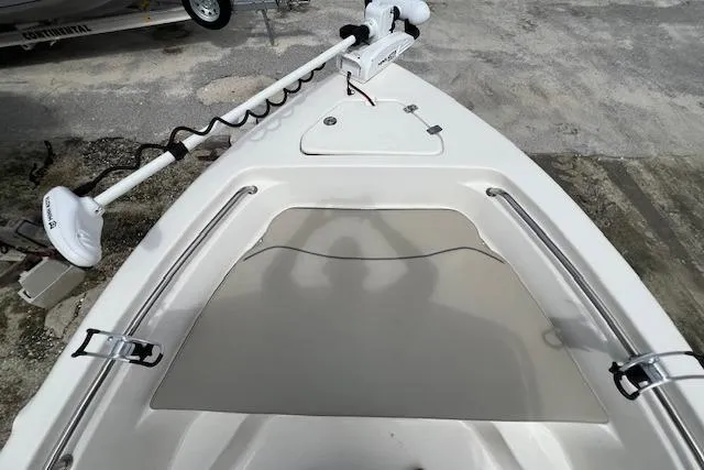 Slide: The Image of 2023 Key West 189 FS boat bow with trolling motor and storage hatch. - 9