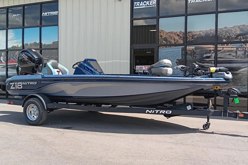 Slide: The Image of 2026 Nitro Z18 boat on trailer outside Tracker Boats dealership. - 1