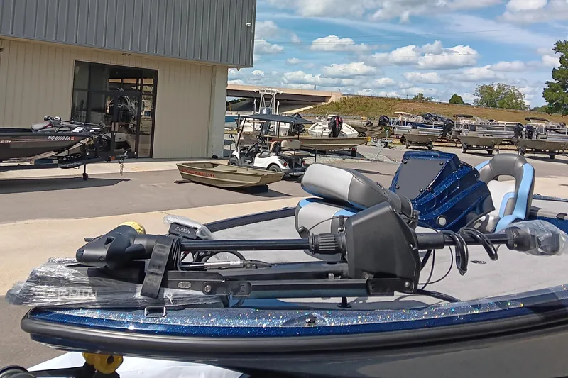 Slide: The Image of 2026 Nitro Z18 boat with advanced equipment, parked outside a dealership under a blue sky. - 7