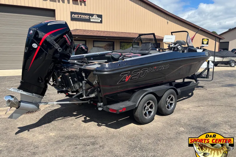 Slide: The Image of 2026 Nitro ZV20 Pro boat with powerful engine, parked at D&R Sports Center. - 3