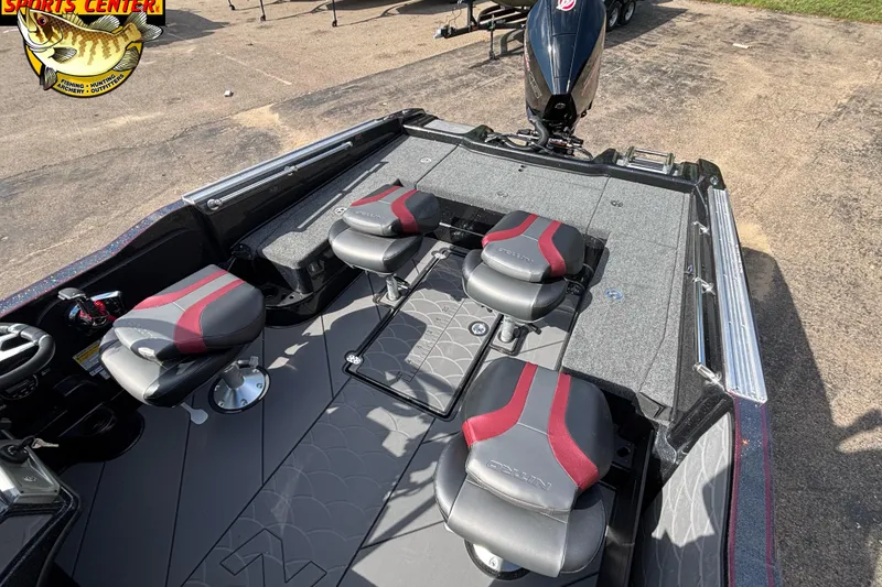Slide: The Image of 2026 Nitro ZV20 Pro boat interior with four seats and steering wheel, parked on pavement. - 5