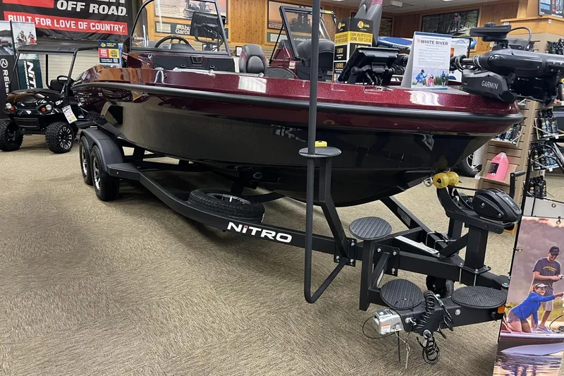 The Image of 2026 Nitro ZV20 Pro boat displayed indoors on a trailer. - 0