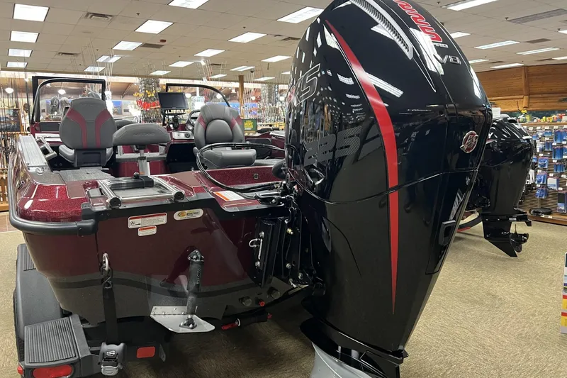 Slide: The Image of 2026 Nitro ZV20 Pro boat with powerful engine displayed in a showroom. - 2