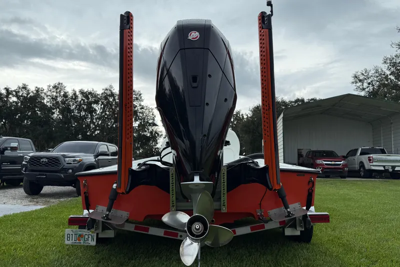 Slide: The Image of Rear view of a 2021 Big O Elite 20 boat on a trailer, parked on grass. - 10