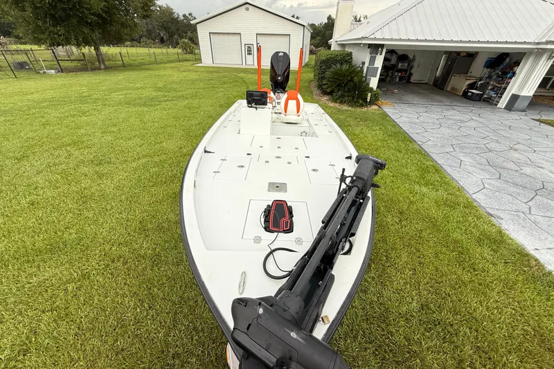 Slide: The Image of Boat on grass near garage, Big O Elite 20, 2021 model. - 17